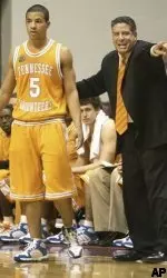 Coach Pearl gives instructions to Chris Lofton against Alabama.