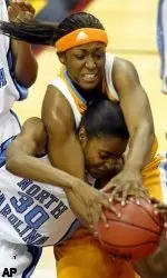 Tennessee's Tye'sha Fluker, top, battles for possession with North Carolina's LaToya Pringle (30) in the first half of the women's NCAA Cleveland regional final Tuesday, March 28, 2006, in Cleveland. (AP Photo/Ron Schwane)