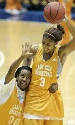 Shannon Bobbitt (00) and Candace Parker (3) joke around during the team's basketball practice, Saturday, in Dayton, Ohio. (AP Photo/Ann Heisenfelt)