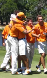 The golf team celebrates after the final hole