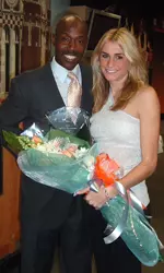 Bowman Standing With Person And Flowers