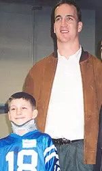 Peyton Manning Standing With Child