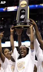 NCAA Trophy Being Held By Group