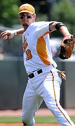 Brown Throwing Baseball