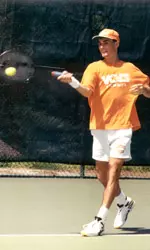 Chris Woodruff Hitting Tennis Ball With Racket