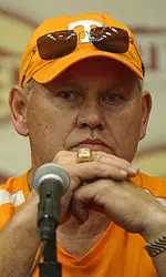 Phillip Fulmer Sitting Behind Microphone