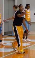 Amber Gray cheers on teammates at practice.