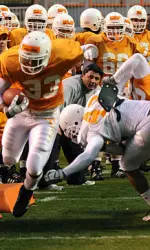 Coach Ed Orgeron has a good view of Toney Williams (33) during a recent practice.