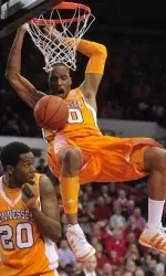 J.P. Prince nearly lands on forward Kenny Hall (20) after dunking the ball