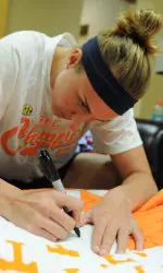 Lady Vol graduate Alicia Manning signs McMurray's quilt.