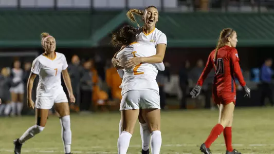 KNOXVILLE, TN - NOVEMBER 16, 2018 - Forward/Midfielder McKinley Burkett #11 and Defender/Forward Danielle Marcano #2 of the Tennessee Volunteers celebrate during the NCAA Tournament Second Round match between the Arizona Wildcats and the Tennessee Volunteers at Regal Soccer Stadium in Knoxville, TN. Photo By Maury Neipris/Tennessee Athletics