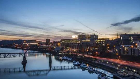 KNOXVILLE, TN - November 23, 2013: Sunset long exposure photo of Neyland stadium, Thompson-Boling Arena and the Vol Navy on the Tennessee River before the SEC matchup between the Vanderbilt Commodores and the Tennessee Volunteers at Neyland Stadium in Knoxville, TN. Photo By Donald Page/Tennessee Athletics