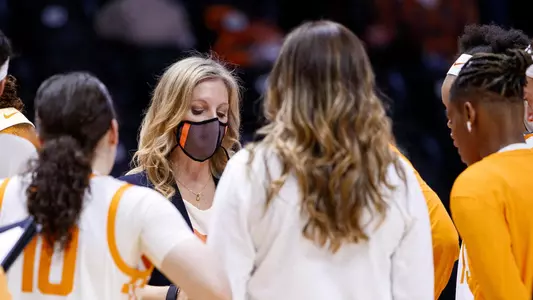 Kellie Harper huddle with mask