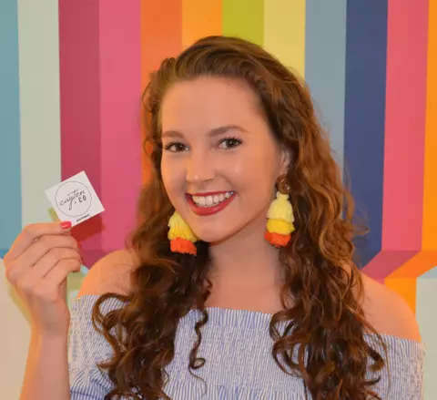 Person Holding Cayten And Co Sticker