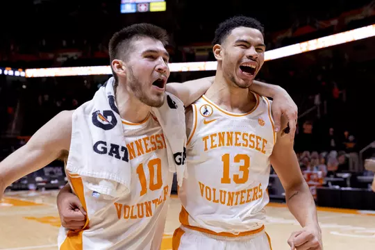 KNOXVILLE, TN - January 30, 2021 - Forward John Fulkerson #10 and Forward Olivier Nkamhoua #13 of the Tennessee Volunteers after the SEC/Big 12 Challenge game between the Kansas Jayhawks and the Tennessee Volunteers at Thompson?Boling Arena in Knoxville, TN. Photo By Andrew Ferguson/Tennessee Athletics