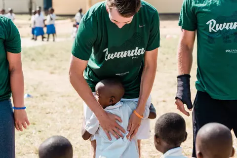 People Hugging At Rwana Event