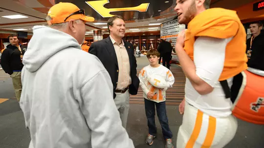 Knoxville, TN - November 24, 2012: quarterback Tyler Bray #8 of the Tennessee Volunteers and Heath Shuler talk in the locker room after the game between the University of Tennessee Volunteers and the Kentucky Wildcats at Neyland Stadium. Photo By Donald Page/Tennessee Athletics