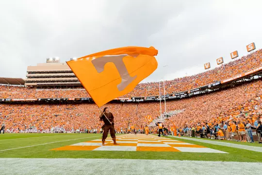 KNOXVILLE, TN - October 15, 2022 - Davy Crockett waves a Power T flag during the game between the Alabama Crimson Tide and the Tennessee Volunteers at Neyland Stadium in Knoxville, TN. Photo By Andrew Ferguson/Tennessee Athletics