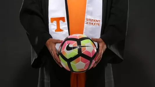 Tennessee soccer student-athlete in cap and gown.