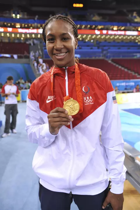 BEIJING, CHINA - AUGUST 23, 2008 - LVFL Tamika Catchings of the USA Basketball Women's National Team poses with gold medals at the 2008 Olympic Games in Beijing, China.