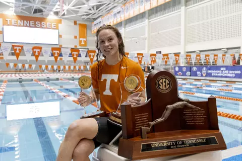 KNOXVILLE, TN - February 19, 2022 - Ellen Walshe of the Tennessee Volunteers with the Women?s Swimmer of the Meet, Commissioner?s Trophy, and SEC Championship trophy after the day five finals session of the 2022 SEC Swimming and Diving Championships at Allan Jones Intercollegiate Aquatic Center in Knoxville, TN. Photo By Andrew Ferguson/Tennessee Athletics