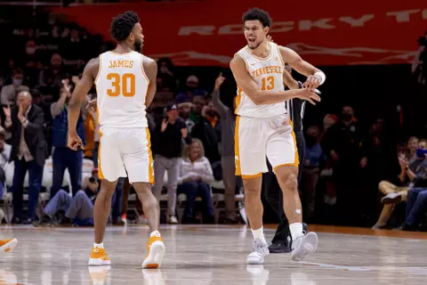 KNOXVILLE, TN - December 22, 2021 - Guard Josiah-Jordan James #30 and Forward Olivier Nkamhoua #13 of the Tennessee Volunteers during the game between the Arizona Wildcats and the Tennessee Volunteers at Thompson?Boling Arena in Knoxville, TN. Photo By Andrew Ferguson/Tennessee Athletics