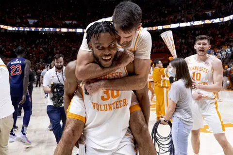 KNOXVILLE, TN - February 26, 2022 - Guard Josiah-Jordan James #30 and Guard Santiago Vescovi #25 of the Tennessee Volunteers after the game between the Auburn Tigers and the Tennessee Volunteers at Thompson?Boling Arena in Knoxville, TN. Photo By Andrew Ferguson/Tennessee Athletics