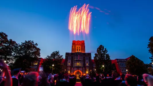 Fireworks explode during Torch Night: A Farewell to Thee, one of UT’s oldest senior traditions, at Ayres Hall on May 19, 2022.Fireworks explode during Torch Night: A Farewell to Thee, one of UT’s oldest senior traditions, at Ayres Hall on May 19, 2022.