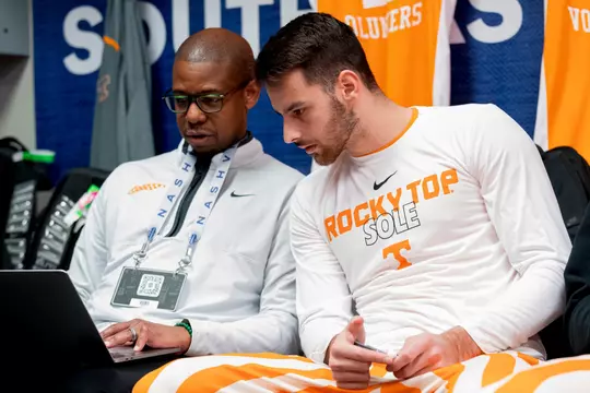 NASHVILLE, TN - March 10, 2023 - Assistant Coach Justin Gainey and Guard Santiago Vescovi #25 of the Tennessee Volunteers before the quarterfinal round game of the the 2023 SEC Men's Basketball Tournament between the Missouri Tigers and the Tennessee Volunteers at Bridgestone Arena in Nashville, TN. Photo By Andrew Ferguson/Tennessee Athletics