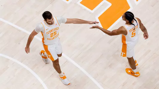 KNOXVILLE, TN - December 21, 2022 - Guard Santiago Vescovi #25 and Guard Zakai Zeigler #5 of the Tennessee Volunteers during the game between the Austin Peay Governors and the Tennessee Volunteers at Thompson?Boling Arena in Knoxville, TN. Photo By Andrew Ferguson/Tennessee Athletics