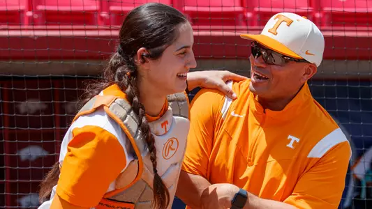 FAYETTEVILLE, AR - May 13, 2023 - Outfielder/Infielder Giulia Koutsoyanopulos #27 and Assistant Coach Chris Malveaux of the Tennessee Lady Volunteers before the 2023 SEC Softball Tournament Championship game between the South Carolina Gamecocks and the Tennessee Lady Volunteers at Bogle Park in Fayetteville, AR. Photo By Kate Luffman/Tennessee Athletics