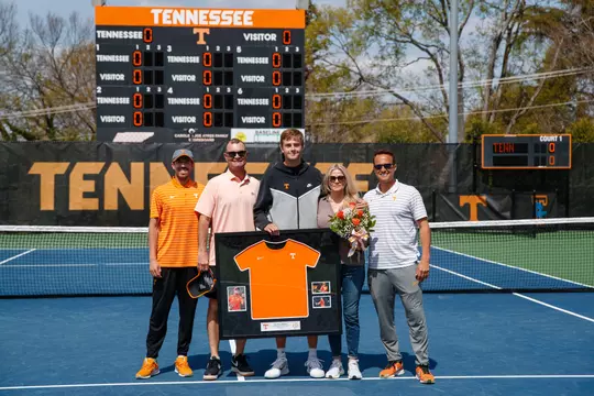 KNOXVILLE, TN - March 31, 2024 - Johannus Monday with family and Assistant Coach James McKie, Head Coach Chris Woodruff and Assistant Coach Jaime Barajas of the Tennessee Volunteers during senior day before the game between the South Carolina Gamecocks and the Tennessee Volunteers at Barksdale Stadium in Knoxville, TN. Photo By Kate Luffman/Tennessee Athletics