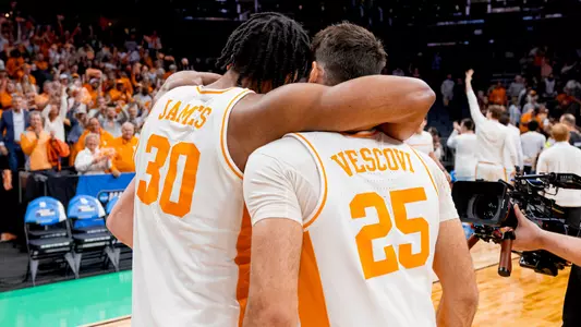 CHARLOTTE, NC - March 23, 2024 - Guard Josiah-Jordan James #30 and Guard Santiago Vescovi #25 of the Tennessee Volunteers after the second round game of the 2024 NCAA Men?s Basketball Tournament between the Texas Longhorns and the Tennessee Volunteers at Spectrum Center in Charlotte, NC. Photo By Andrew Ferguson/Tennessee Athletics