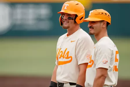 KNOXVILLE, TN - April 29, 2023 - Infielder Blake Burke #25 and Student Assistant Coach Ricky Martinez of the Tennessee Volunteers during the game between the Mississippi State Bulldogs and the Tennessee Volunteers at Lindsey Nelson Stadium in Knoxville, TN. Photo By Ian Cox/Tennessee Athletics