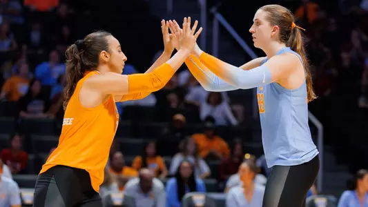 Kubik and Guctekin high-five after point in match against South Carolina