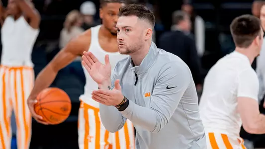 NEW YORK, NY - December 10, 2024 - Assistant Director of Player Development Riley Collins of the Tennessee Volunteers before the Jimmy V Classic game between the Miami Hurricanes and the Tennessee Volunteers at Food City Center in Knoxville, TN. Photo By Andrew Ferguson/Tennessee Athletics