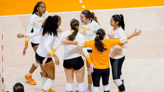 Team Celebrates Point in Match Against Samford