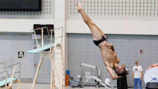 Owen Redfearn Performs Dive in Home Meet