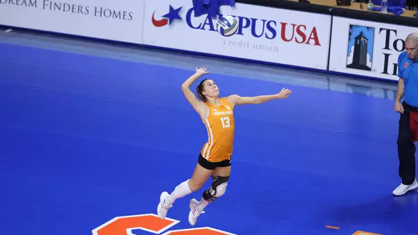 Raegan Burns delivers serve in match against Florida