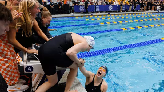 Spink Celebrates 50 Free Giold with Teammates at 2026 SEC Championships