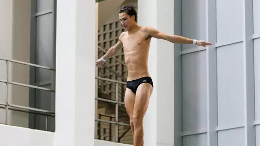 Bennett Greene Dives on 3-meter Springboard in Competition at Allan Jones Intercollegiate Aquatic Center