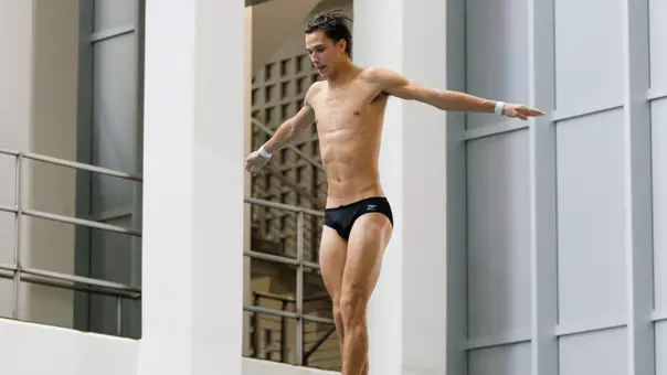 Bennett Greene Dives on 3-meter Springboard in Competition at Allan Jones Intercollegiate Aquatic Center