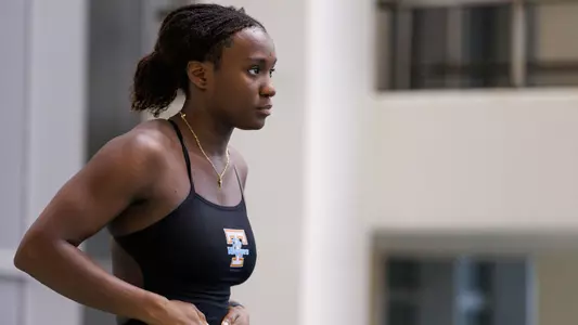 Desharne Bent-Ashmeil Prepares for Dive in Meet at Allan Jones Aquatic Center