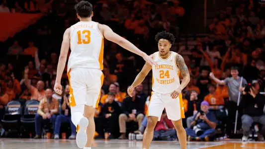 KNOXVILLE, TN - December 30, 2025 - Forward J.P. Estrella #13 and Guard Troy Henderson #24 of the Tennessee Volunteers during the game between the South Carolina State Bulldogs and the Tennessee Volunteers at Food City Center in Knoxville, TN. Photo By Elliot Walker/Tennessee Athletics