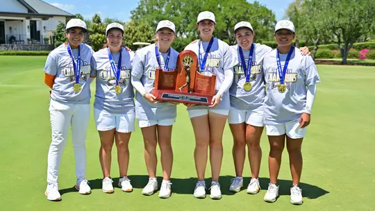 BELLEAIR, FL - April 21, 2026 - Kaopan Thapasit, Madison Messimer, Sofie Engeseth, Kyra Van Kan, Sophie Christopher and Manassanan Chotikabhukkana of the Tennessee Lady Volunteers with the 2026 SEC WomenÕs Golf Championship trophy during the Match Play Final of the 2026 SEC WomenÕs Golf Championship at Pelican Golf Club in Belleair, FL. Photo By Rob Davis