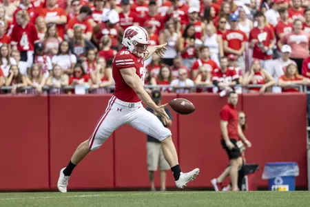 Wisconsin Badgers punter Andy Vujnovich (38) punts the ball during a NCAA college football game against the Michigan Wolverines, Saturday, Oct. 2, 2021, in Madison, Wis.