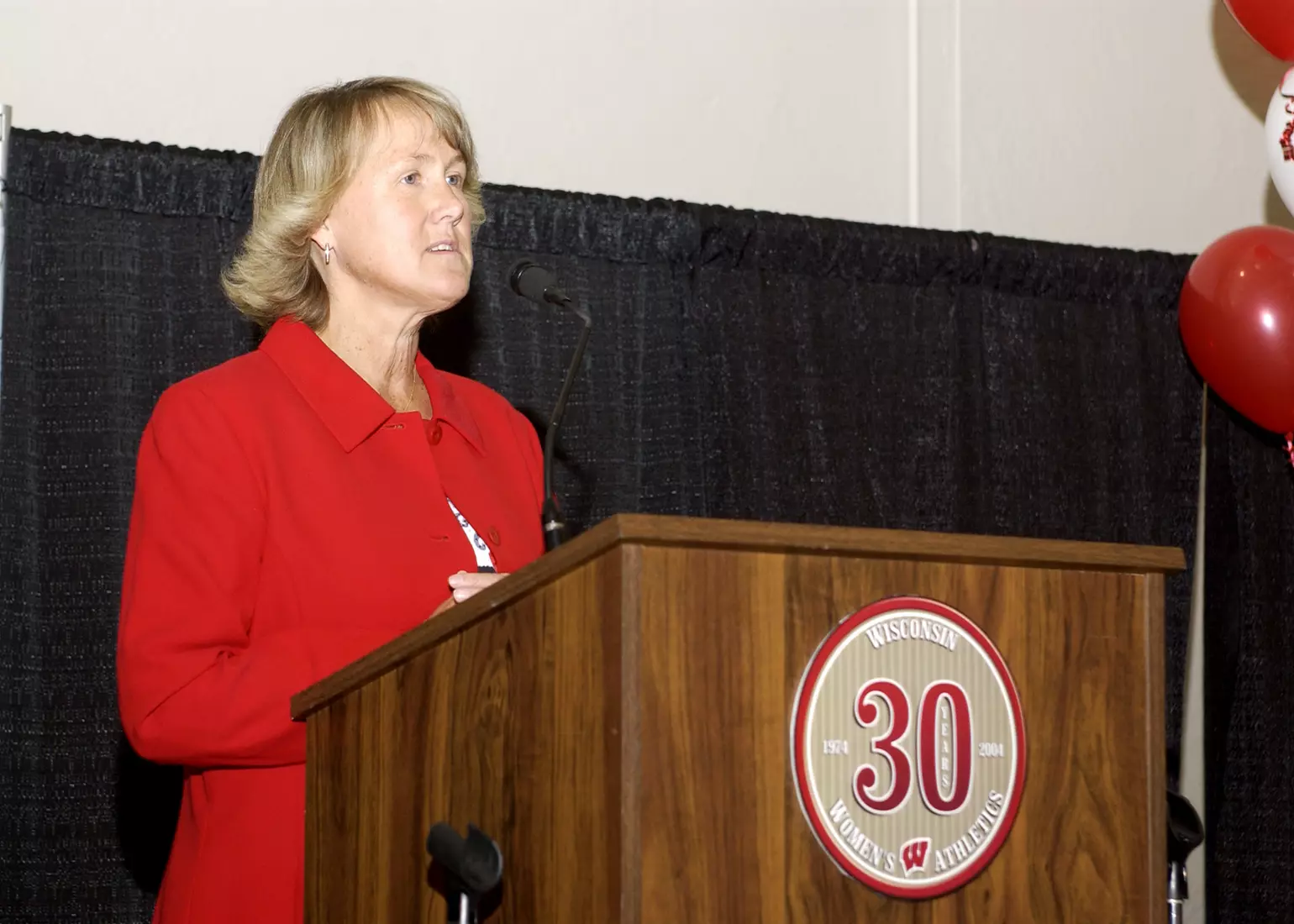 Former Wisconsin senior associate athletic director Cheryl Bailey speaking at the 30th anniversary of women's athletics at the UW in 2005