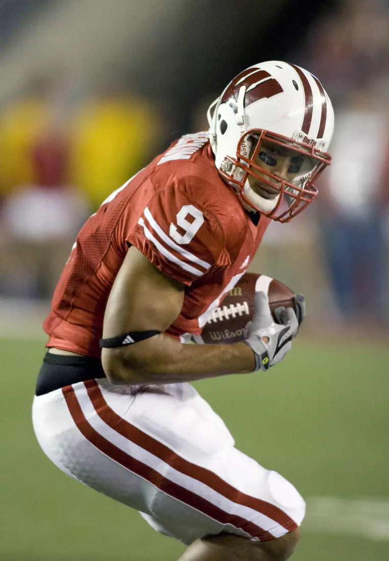 Tight end Travis Beckum #9 of the Wisconsin Badgers gains yardage on a reception against the Ohio State Buckeyes at Camp Randall Stadium on October 4, 2008 in Madison, Wisconsin. The Buckeyes beat the Badgers 20-17.