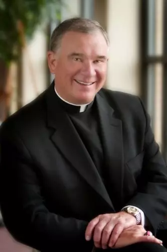 Monsignor Michael Burke (shared by St. Maria Goretti)