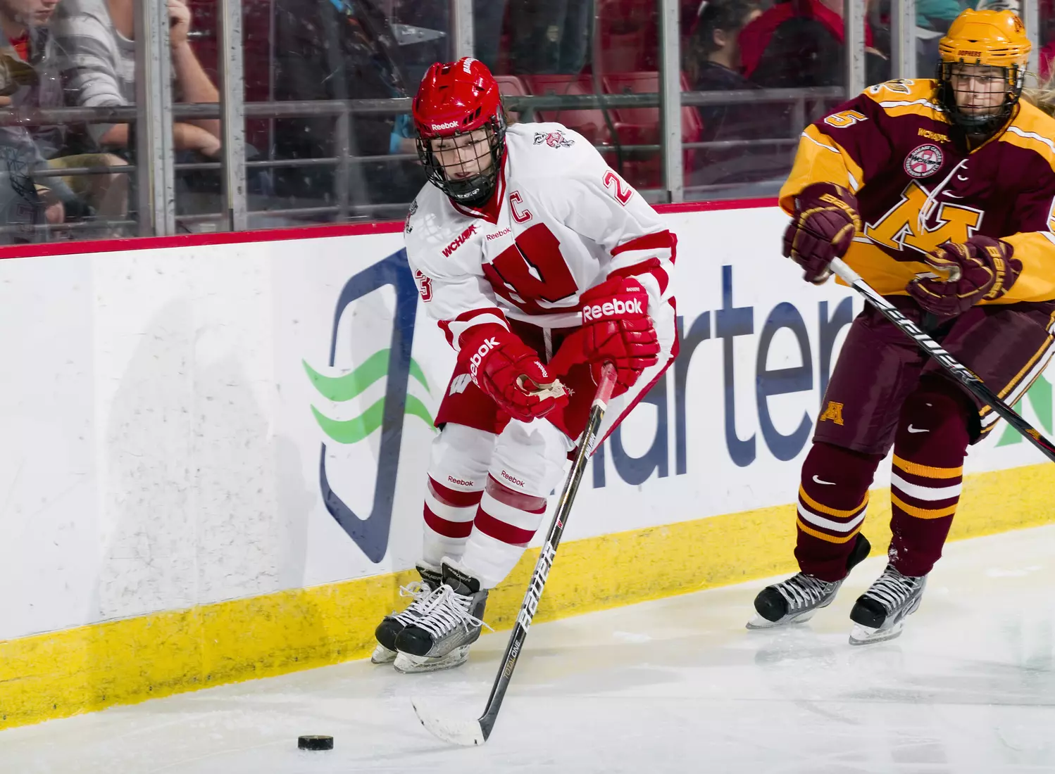 Wisconsin Badgers Hilary Knight (23) handles the puck during an NCAA women's hockey game against the Minnesota Golden Gophers on October 14, 2011 in Madison, Wisconsin. The Badgers won 3-2. (Photo by David Stluka)